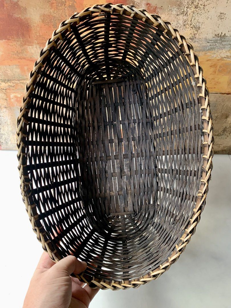 Oval Handwoven Rattan or Wicker Storage (Category: Storage Boxes & Baskets) located in Tandag. Submitted by jeason_22 (Listing ID 1468338692, Image 2). Description: oval handwoven rattan or wicker storage basket featuring a braided rim and two-tone brown and natural weave. .