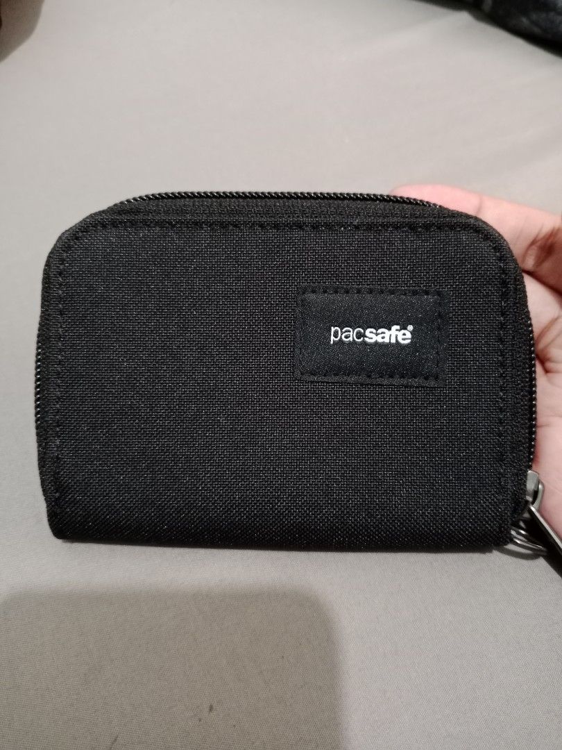 Pacsafe RFIDsafe Black Zip Wallet (Category: Wallets & Card holders) located in Cabuyao City. Submitted by jcbc0120 (Listing ID 1468327096, Image 1). Description: Original pacsafe Brandnew Never pa ginamit,tanggal nalang yung tag - Brand: Pacsafe - Color: Classic Black - Security: Built-in RFID-blocking material to protect cards - Organization: Multiple card slots and compartments - Material: Durable canvas exterior - Design: Compact zip-around s