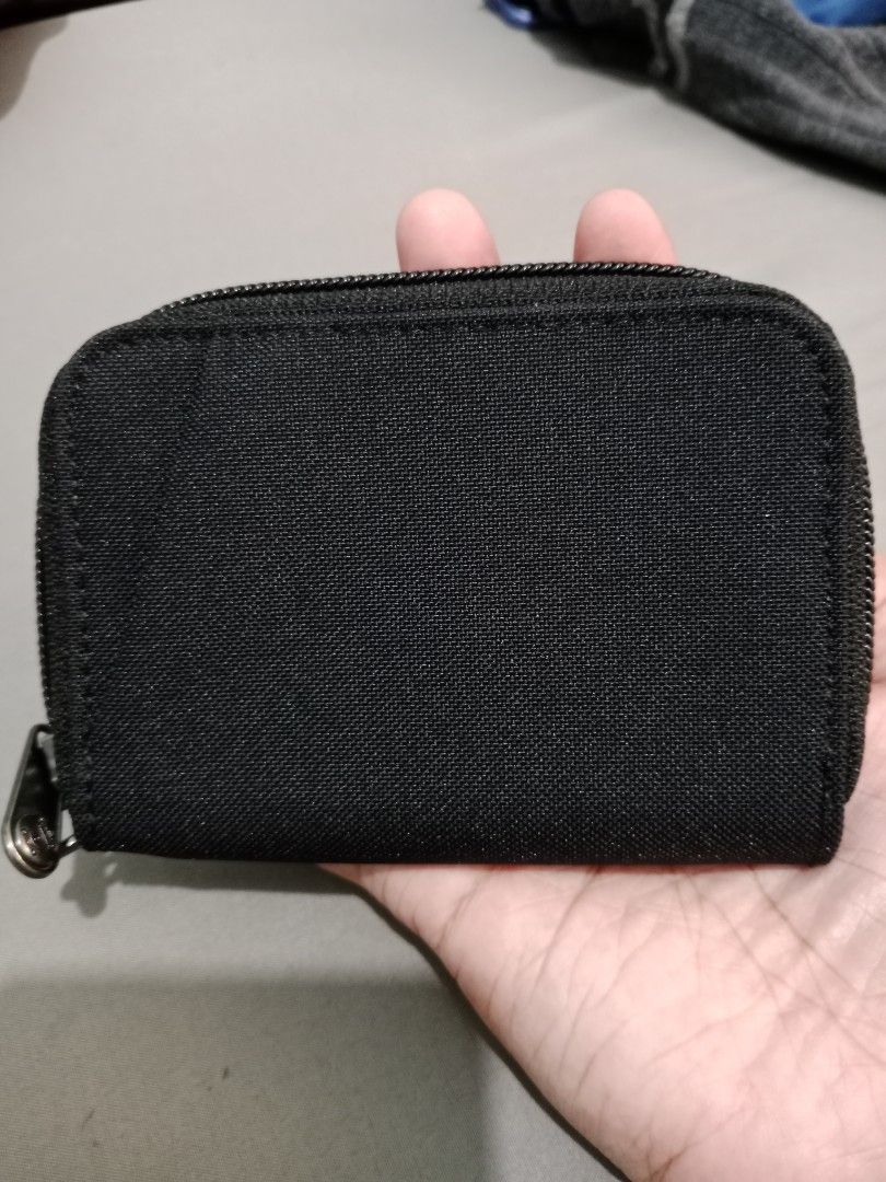 Pacsafe RFIDsafe Black Zip Wallet (Category: Wallets & Card holders) located in Cabuyao City. Submitted by jcbc0120 (Listing ID 1468327096, Image 3). Description: Original pacsafe Brandnew Never pa ginamit,tanggal nalang yung tag - Brand: Pacsafe - Color: Classic Black - Security: Built-in RFID-blocking material to protect cards - Organization: Multiple card slots and compartments - Material: Durable canvas exterior - Design: Compact zip-around s
