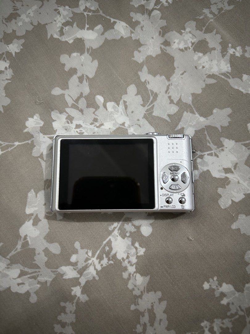Panasonic Lumix DMC-FX8 Digital Camera Full Set (Category: Cameras) located in Quezon City. Submitted by _samanthajyc (Listing ID 1468375982, Image 2). Description: - Model: Panasonic Lumix DMC-FX8 Compact Digital Camera (Silver) - Condition: Powers on and functions properly with normal signs of use - Complete Bundle: Includes original box, battery, and battery charger - Storage & Extras: Comes with a 2GB Transcend SD card and protective carrying