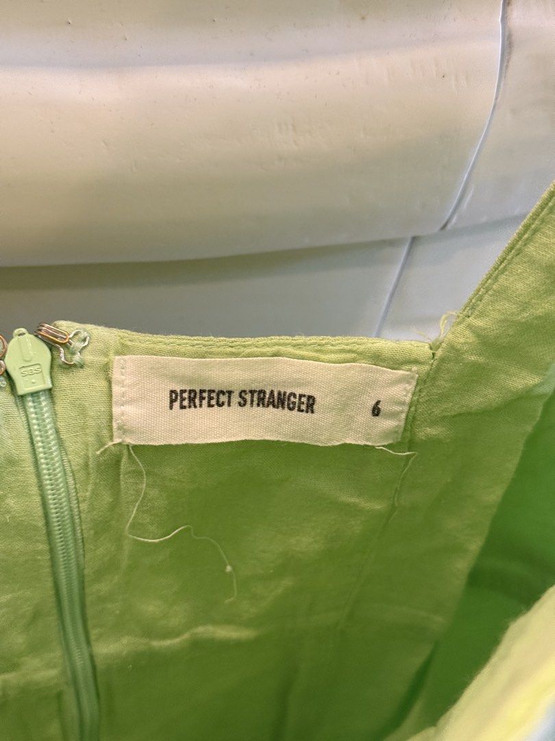 Perfect Stranger Green Square Neck Mini Dress Size 6 (Category: Dresses) located in Angeles City. Submitted by adeclutters__ (Listing ID 1468340941, Image 3). Description: - Brand: Perfect Stranger - Size: AU/US 6 - Color: Bright green - Style: Mini dress with square neckline, thick straps, and structured front panels - Closure: Back zipper - Fabric: Slightly textured - Condition: Worn a couple of times, clean and well-maintained - Perfect for: S