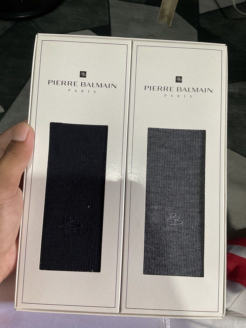 Pierre Balmain Paris Socks Gift Box Set Black Grey (Category: Socks) located in Caloocan City. Submitted by archievest.112116 (Listing ID 1468290345, Image 2). Description: - Brand: Pierre Balmain Paris - Item: Boxed sock set (2 pairs) - Colors: Black and grey - Details: Subtle embroidered PB monogram near the ribbed top - Material: Wool, nylon, and polyester blend (per box sticker) - Packaging: Original box included, great for gifting - Conditio