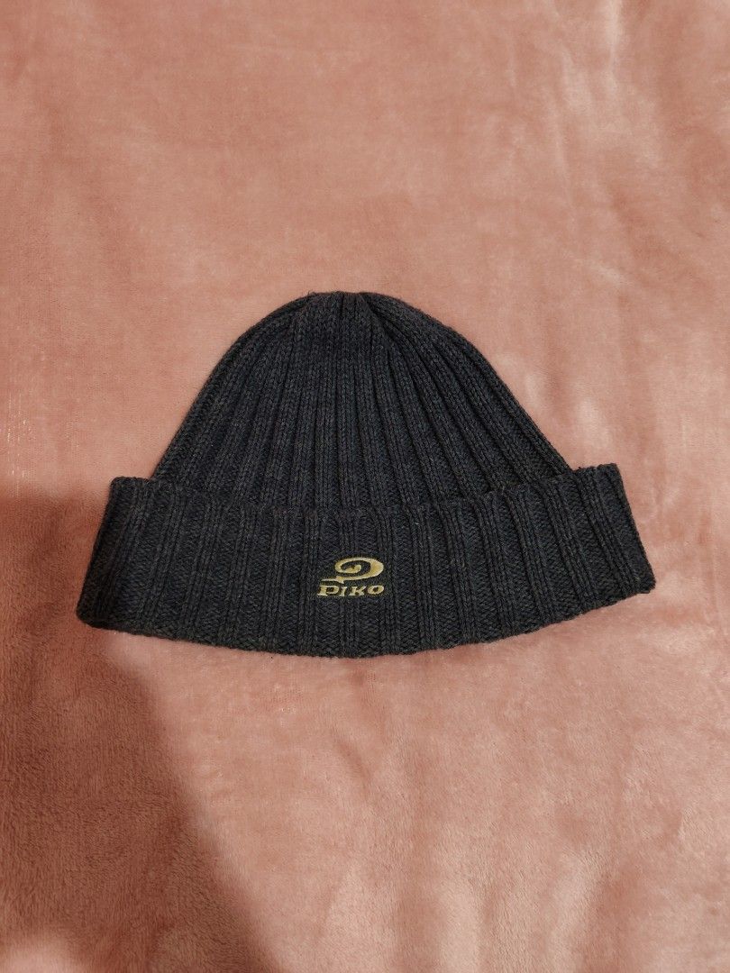 Piko Ribbed Knit Beanie Dark Grey Winter Hat (Category: Hats & Beanies) located in Villasis. Submitted by trip_thrift15 (Listing ID 1468390889, Image 1). Description: - Brand: Piko - Color: Dark grey - Material: Soft ribbed knit texture - Design: Foldover cuff with gold and dark green embroidered logo patch - Condition: Inside tag attached - Features: Keeps your head warm and cozy MOP-GCASH/MAYA JNT COURIER PRICE+SF.