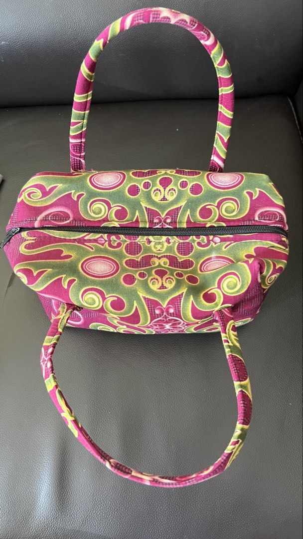 Pink and green patterned fabric handbag with handles (Category: Shoulder Bags) located in Taguig. Submitted by xkmanzano078817 (Listing ID 1468414106, Image 2). Description: - Trendy fabric handbag with an eye-catching pink, green, and yellow abstract print - Compact and lightweight design, ideal for daily use - Features comfortable double top handles for easy carrying - Secure top zipper closure to keep your essentials safe - Clean black fabric 