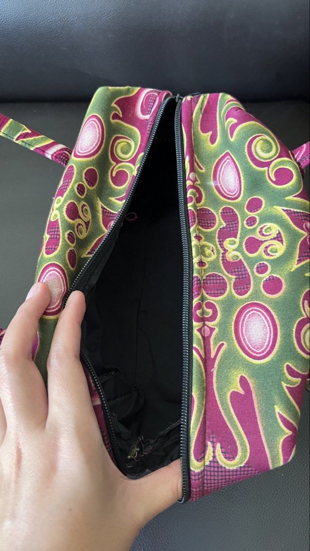 Pink and green patterned fabric handbag with handles (Category: Shoulder Bags) located in Taguig. Submitted by xkmanzano078817 (Listing ID 1468414106, Image 3). Description: - Trendy fabric handbag with an eye-catching pink, green, and yellow abstract print - Compact and lightweight design, ideal for daily use - Features comfortable double top handles for easy carrying - Secure top zipper closure to keep your essentials safe - Clean black fabric 