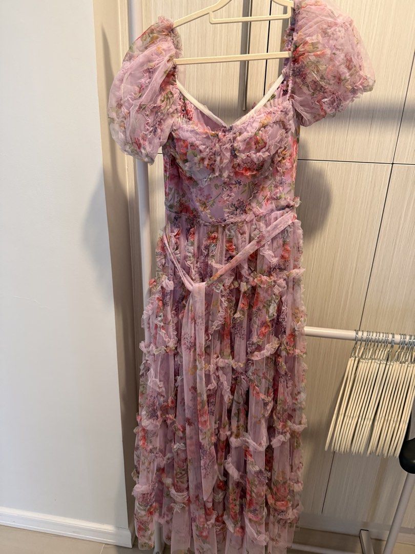 Pink Floral Gown (Category: Dresses) located in Cebu City. Submitted by onlineclosetbypat (Listing ID 1468284706, Image 2). Description: - Brand: Bangkok - Style: Floral tulle dress with all-over ruffles - Color: Soft pink and purple tones with vibrant flower print - Details: Sweetheart neckline, puff sleeves, and back zipper closure - Included: Matching tie belt at the waist - Size: Small (S) - Condition: Excellent / Never Used - Perfect for: We