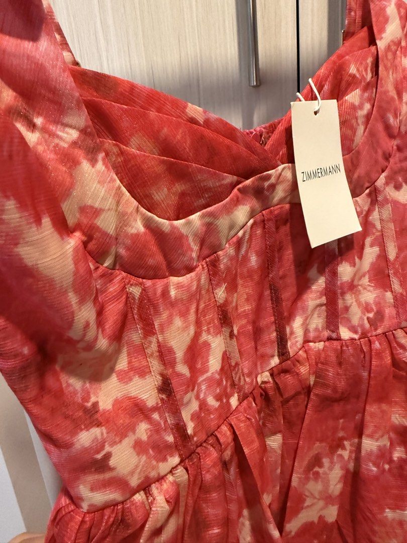 Pink Floral Mini Dress (Category: Dresses) located in Cebu City. Submitted by onlineclosetbypat (Listing ID 1468284862, Image 3). Description: - Brand: Bangkok - Size: S (Brand tag attached) - Color/Pattern: Pink floral - Design: Fitted bodice with boning, sweetheart neckline, and adjustable straps - Closure: Smocked back panel with central zipper - Skirt: Flared with pleated gathering.
