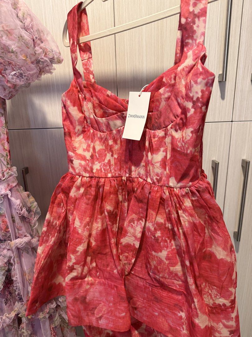Pink Floral Mini Dress (Category: Dresses) located in Cebu City. Submitted by onlineclosetbypat (Listing ID 1468284862, Image 2). Description: - Brand: Bangkok - Size: S (Brand tag attached) - Color/Pattern: Pink floral - Design: Fitted bodice with boning, sweetheart neckline, and adjustable straps - Closure: Smocked back panel with central zipper - Skirt: Flared with pleated gathering.