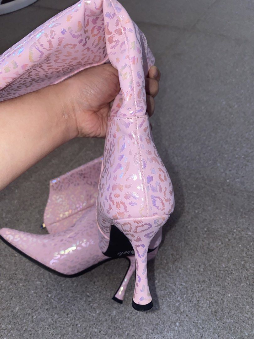 Pink Holographic Leopard Print High Heel Boots (Category: Boots) located in Pasay City. Submitted by violetttttttttttttt (Listing ID 1468356509, Image 2). Description: - Style: Pink knee-high boots with iridescent holographic leopard print - Design: Pointed toe and sleek stiletto heel - Fit & Closure: Full side zipper for easy wear, cream-colored interior lining - Size: 37 (stamped on sole) - Condition: Soles show minor wear from being tried on o