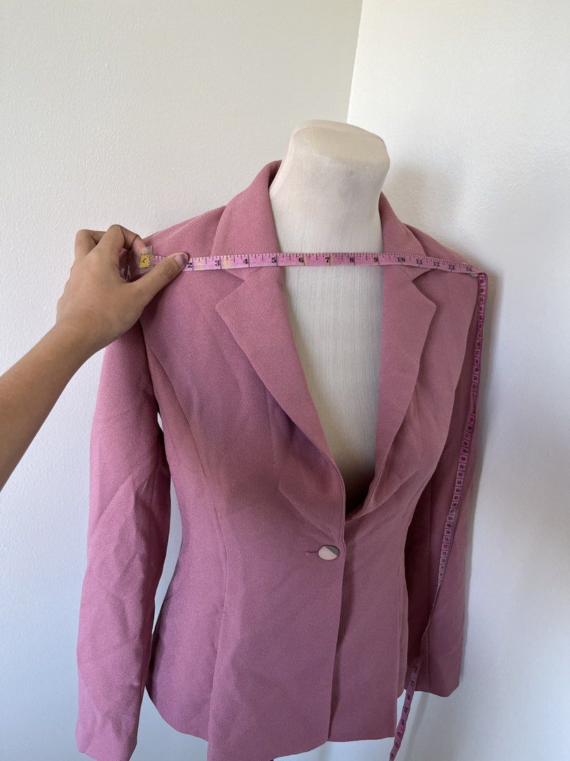 Pink tailored single-button blazer jacket (Category: Coats, Jackets and Outerwear) located in Mandaluyong City. Submitted by bravedeer.020ad7 (Listing ID 1468368079, Image 3). Description: - Color: Dusty Pink - Style: Professional wear or smart casual - Features: Notched lapels, single front button, structured shoulders, pleated waist detailing - Sleeves: Long - Measurements: ~14 inches across shoulders, ~24 inches total length - Condition: Clean