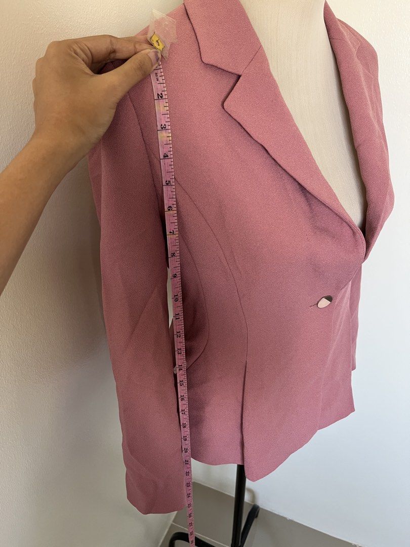 Pink tailored single-button blazer jacket (Category: Coats, Jackets and Outerwear) located in Mandaluyong City. Submitted by bravedeer.020ad7 (Listing ID 1468368079, Image 2). Description: - Color: Dusty Pink - Style: Professional wear or smart casual - Features: Notched lapels, single front button, structured shoulders, pleated waist detailing - Sleeves: Long - Measurements: ~14 inches across shoulders, ~24 inches total length - Condition: Clean