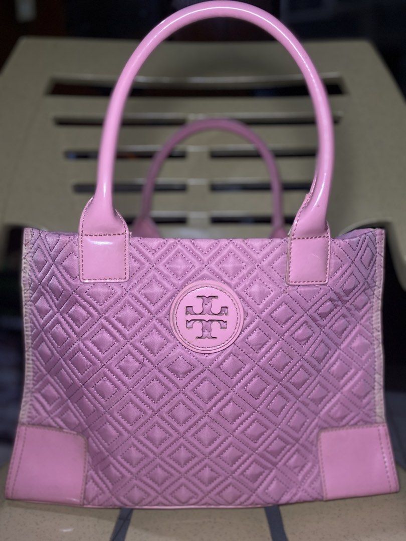 Pink Tory Burch Quilted Tote Bag (Category: Tote Bags) located in Manila. Submitted by orcharchives (Listing ID 1468377506, Image 1). Description: -Tory Burch - Quilted tote bag in pink - iconic circular logo medallion, fabric-lined interior with a zipper pocket and compartments - ❗️Condition: Pre-loved with some visible fading color along the side seams and edge wear chips on the handles❗️ - Perfect for daily use or casual outings.