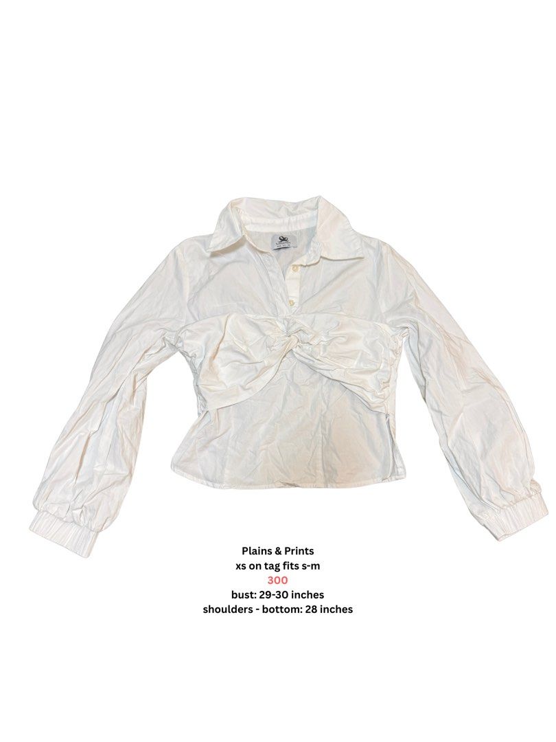 Plains & Prints White Long Sleeve Twist Front Blouse (Category: Longsleeves) located in Angeles City. Submitted by vega.rachel (Listing ID 1468284623, Image 2). Description: - Brand: Plains & Prints - Color: White - Size: Tagged XS, fits S-M comfortably - Design: Long sleeves, stylish twisted knot across the front, collar neckline, partial chest buttons, and elastic cuffs - Measurements: Bust 29-30 inches, Total Length 28 inches - Condition: Exce