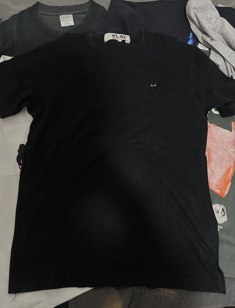 Play CDG Comme des Garcons Shirt (Category: Shirts) located in Subic. Submitted by declutterbyshit (Listing ID 1468378491, Image 1). Description: Play Comme des Garcons black tee, size large. Classic little heart logo embroidered on the chest. Crew neck collar, short sleeves. Simple staple piece for everyday outfits. Easy to style with denim or joggers. Standard fit..