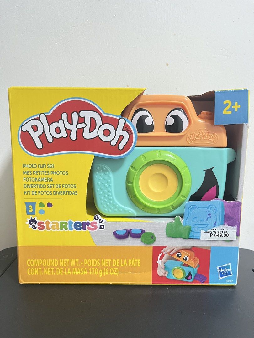 Play-Doh Starters Photo Fun Set Toy (Category: Kids Toys) located in Santo Tomas. Submitted by infinite_shop06 (Listing ID 1468418952, Image 1). Description: Play-Doh Photo Fun Set - Recommended Age: 2 years old and up - Features: Camera-shaped press, fun molds, and 170g of colorful Play-Doh compound - Activities: Stamp pictures, create goofy faces, and press out fun shapes - Condition: Brand new.