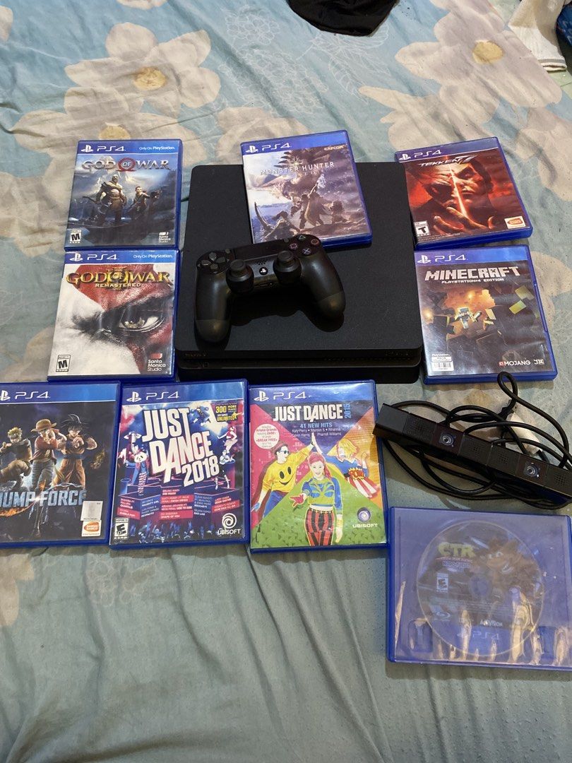 PlayStation 4 Console with Controller and 9 Games (Category: PlayStation) located in Manila. Submitted by devilsdontcry (Listing ID 1468497720, Image 1). Description: - PlayStation 4 Console Package - 1 x Black DualShock Controller - Power Cable & PlayStation Camera included - 9 Game Discs: God of War, God of War Remastered, Monster Hunter World, Tekken 7, Minecraft PS4 Edition, Jump Force, Just Dance 2018, Just Dance 2015, and Crash Team Racing 