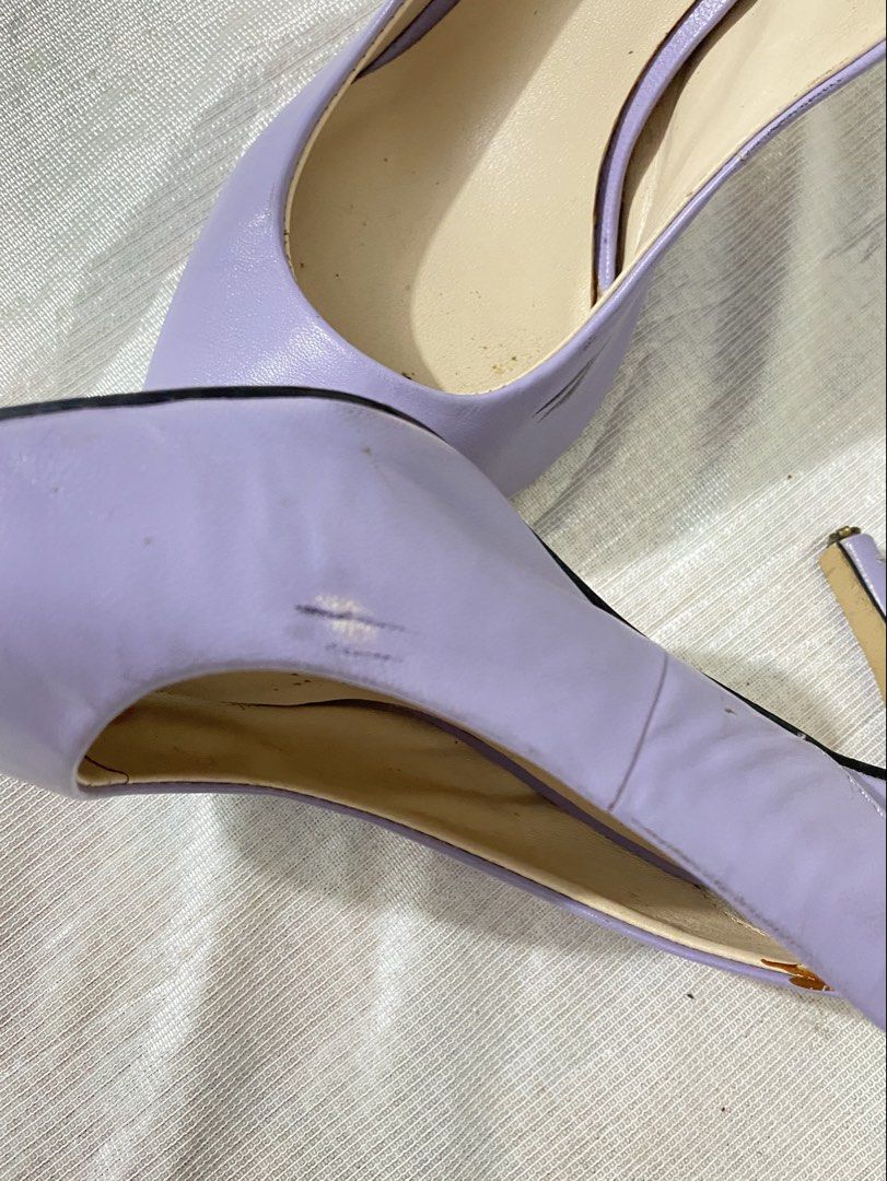 Pointed-Toe Slingback Heels / Pumps (Category: Sandals) located in Baguio. Submitted by sollunathrift13 (Listing ID 1468449035, Image 3). Description: Color: Pastel Lavender / Light Purple Material: Faux Leather / Leatherette Toe Style: Sleek pointed toe. Back Style: Elasticized / stretch slingback strap for fit. Heel Style: Slim high stiletto heel. Insole: Cream-colored cushioned insole. Left Shoe Side: Visible black scuff marks / friction rub o