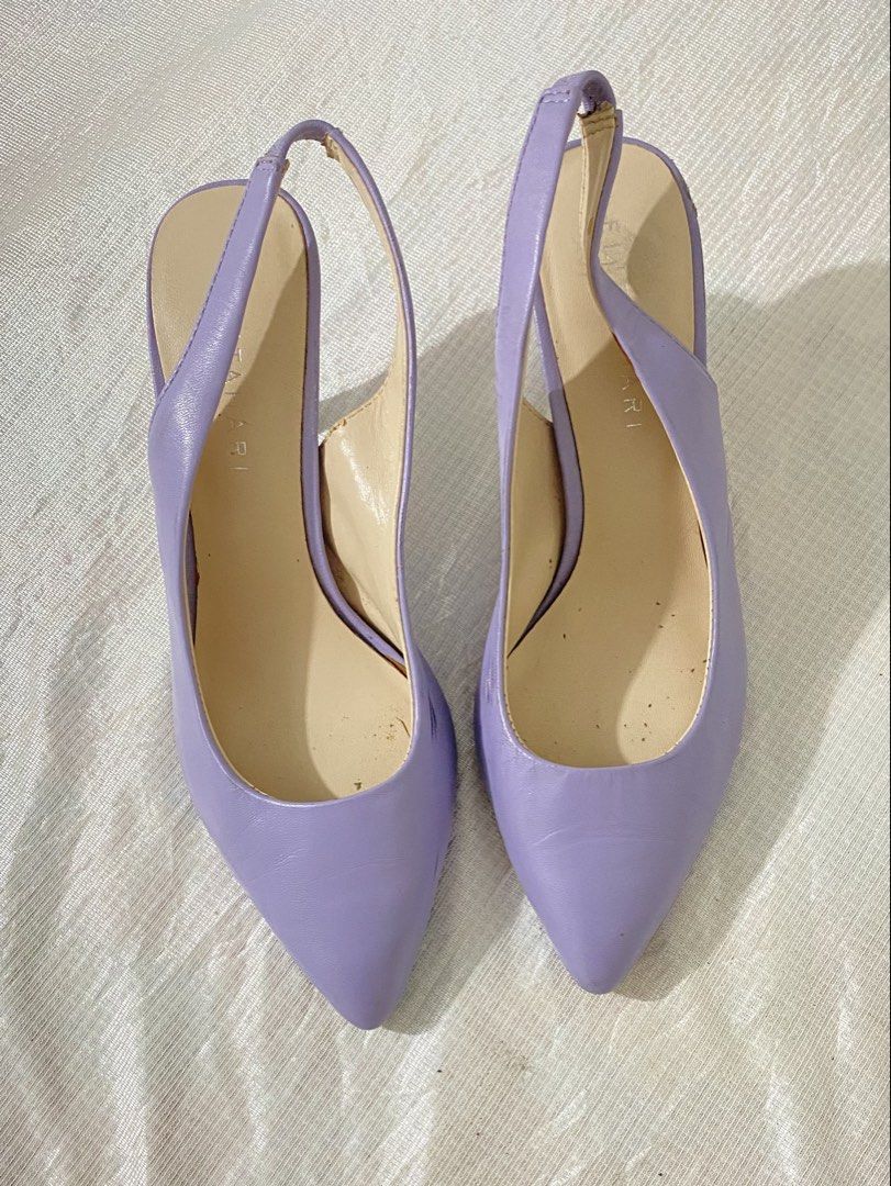 Pointed-Toe Slingback Heels / Pumps (Category: Sandals) located in Baguio. Submitted by sollunathrift13 (Listing ID 1468449035, Image 2). Description: Color: Pastel Lavender / Light Purple Material: Faux Leather / Leatherette Toe Style: Sleek pointed toe. Back Style: Elasticized / stretch slingback strap for fit. Heel Style: Slim high stiletto heel. Insole: Cream-colored cushioned insole. Left Shoe Side: Visible black scuff marks / friction rub o