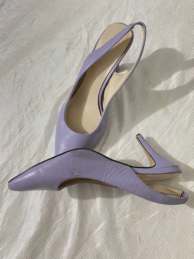 Pointed-Toe Slingback Heels / Pumps (Category: Sandals) located in Baguio. Submitted by sollunathrift13 (Listing ID 1468449035, Image 1). Description: Color: Pastel Lavender / Light Purple Material: Faux Leather / Leatherette Toe Style: Sleek pointed toe. Back Style: Elasticized / stretch slingback strap for fit. Heel Style: Slim high stiletto heel. Insole: Cream-colored cushioned insole. Left Shoe Side: Visible black scuff marks / friction rub o