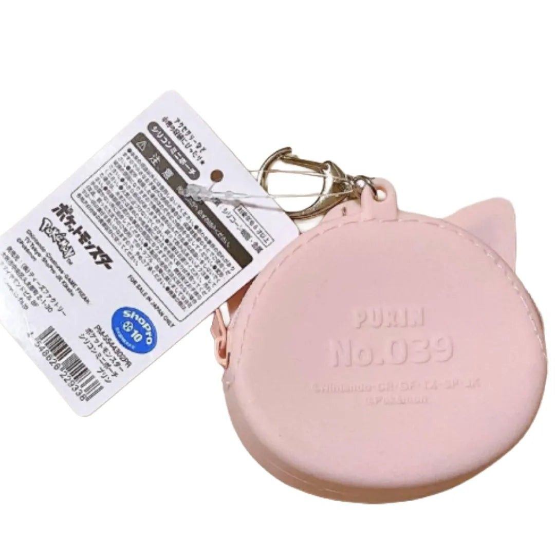 Pokemon Jigglypuff Silicone Mini Pouch Keychain (Category: Character Goods) located in Quezon City. Submitted by curatedbymissgee (Listing ID 1468296087, Image 3). Description: - Official Pokémon merchandise from Japan - Genuine Jigglypuff silicone mini pouch with original paper tag - Features cute Jigglypuff face design on front and embossed text on back - Secure zip closure to keep small items safe - Convenient keychain attachment to easily hoo