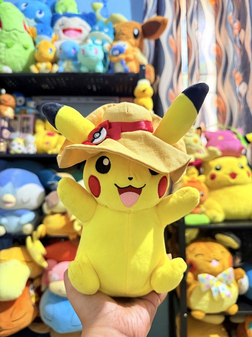 Pokemon Pikachu Plush with Summer Hat (Category: Plushies & Soft Toys) located in Cavite. Submitted by projectplushie (Listing ID 1468384831, Image 1). Description: - Adorable Pikachu plush holding hands up with a cheerful smiling expression - Features a stylish yellow straw hat with a red ribbon and Poké Ball accent - Perfect for Pokémon collections, gifts, or desk/shelf display.