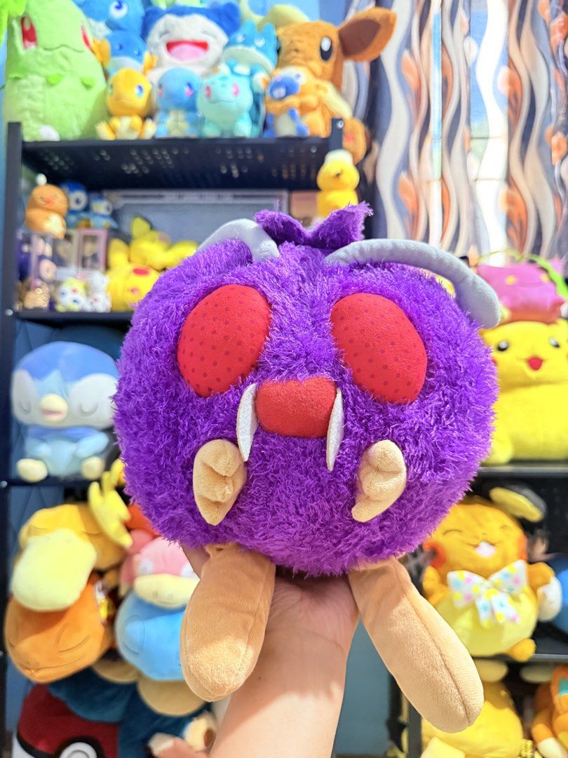 Pokémon Venonat Plush Toy (Category: Plushies & Soft Toys) located in Cavite. Submitted by projectplushie (Listing ID 1468383561, Image 1). Description: - Official-style purple Venonat Pokémon plush toy - Soft fuzzy fabric with vibrant colors and clean overall condition - Distinctive features: large red eyes, white fangs, grey antennae, and dangling tan feet - Great addition to any plush collection, room decor, or fan display.