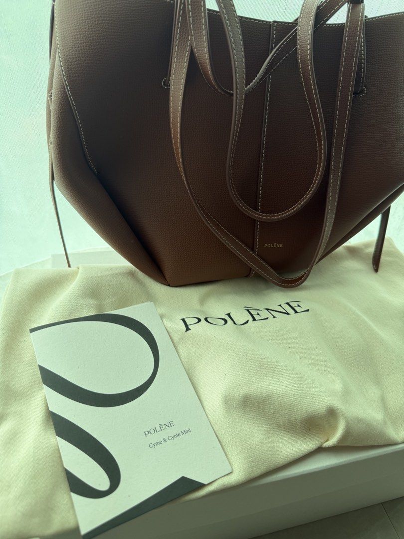 Polène Cyme Mini cognac (Category: Luxury Bags & Wallets) located in Cainta. Submitted by lovedbyiris975 (Listing ID 1468303053, Image 2). Description: - buttons still have protective layer of plastic - Complete with original dust bag, booklet, and white storage box.