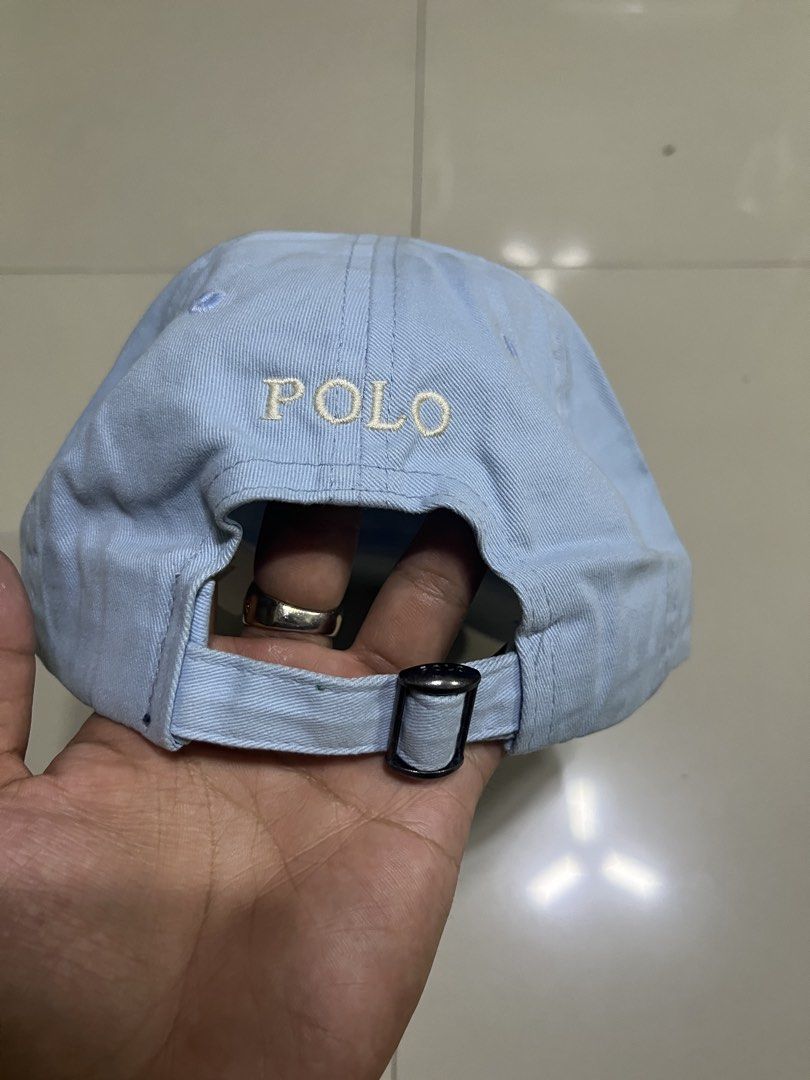 Polo Ralph Lauren Light Blue Baseball Cap (Category: Caps & Hats) located in Quezon City. Submitted by flip_da_cash (Listing ID 1468450631, Image 3). Description: - Brand: Polo Ralph Lauren - Color: Light blue - Material: 100% cotton - Design: Classic embroidered pony logo on front, POLO text stitched on back strap - Closure: Adjustable metal buckle - Condition: Clean fabric throughout with original interior tags.