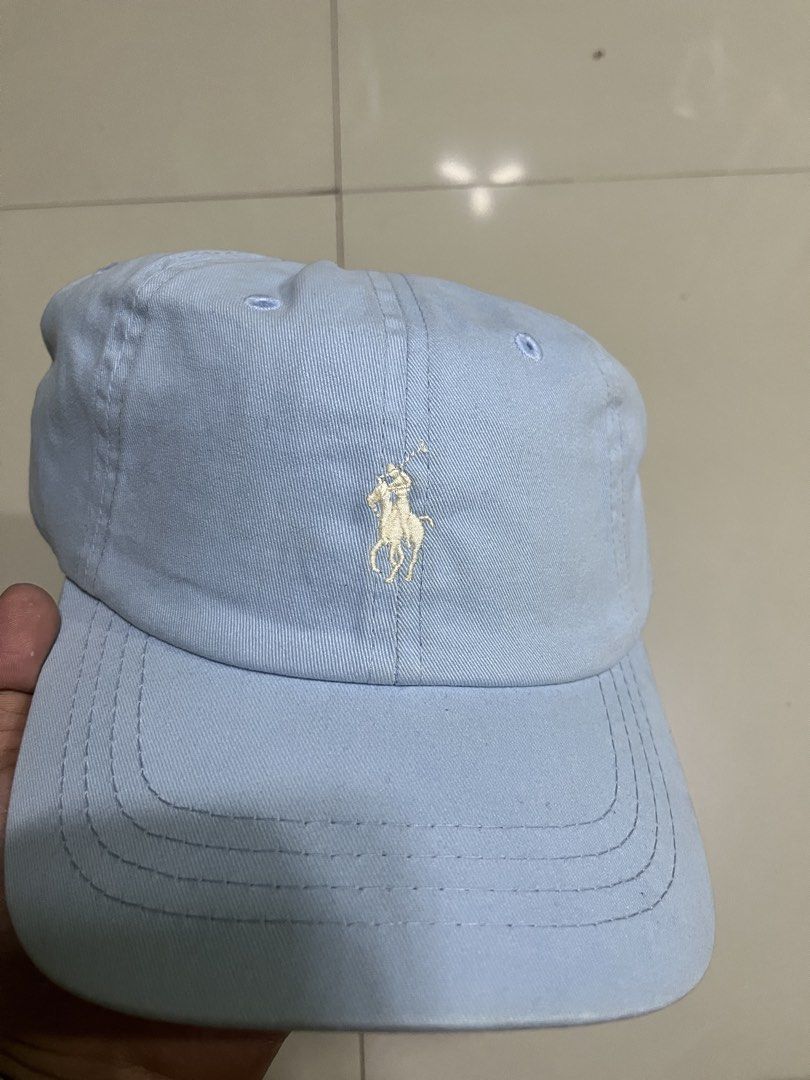 Polo Ralph Lauren Light Blue Baseball Cap (Category: Caps & Hats) located in Quezon City. Submitted by flip_da_cash (Listing ID 1468450631, Image 2). Description: - Brand: Polo Ralph Lauren - Color: Light blue - Material: 100% cotton - Design: Classic embroidered pony logo on front, POLO text stitched on back strap - Closure: Adjustable metal buckle - Condition: Clean fabric throughout with original interior tags.