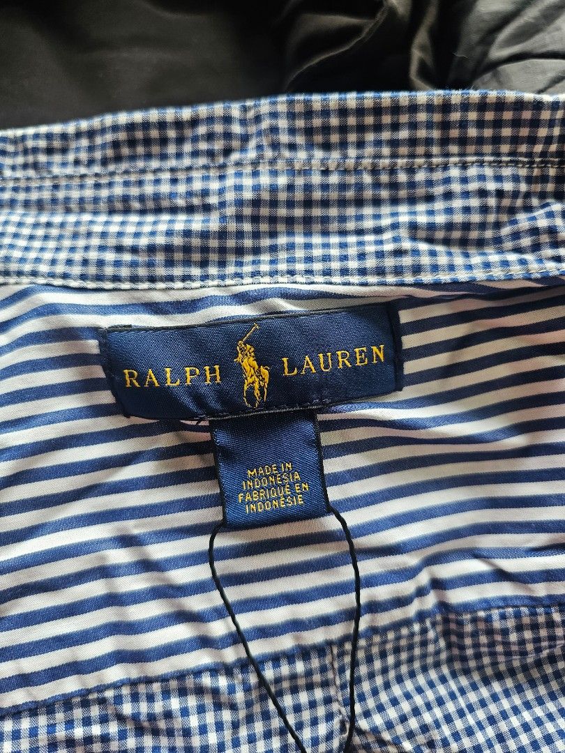 Polo Ralph Lauren long-sleeve button-down shirt (Category: Formal Shirts) located in Baguio. Submitted by kayeonlineshop (Listing ID 1468298767, Image 3). Description: Polo Ralph Lauren long-sleeve button-down shirt featuring an asymmetrical or "fun/crazy" pattern mix of blue and white gingham checks..