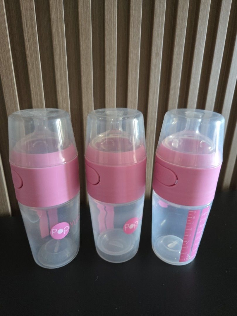 PopYum Baby Bottles Pink (Category: Breastfeeding & Bottle Feeding) located in Manila. Submitted by luxtimeless (Listing ID 1468321159, Image 1). Description: - Set of 3 PopYum baby bottles - Features cute pink accents and clear protective caps - Standard measuring marks printed clearly on the side - Ergonomic, easy-to-hold shape with convenient push buttons - Clean, well-maintained, and ready for immediate use - Perfect upgrade or addition to yo