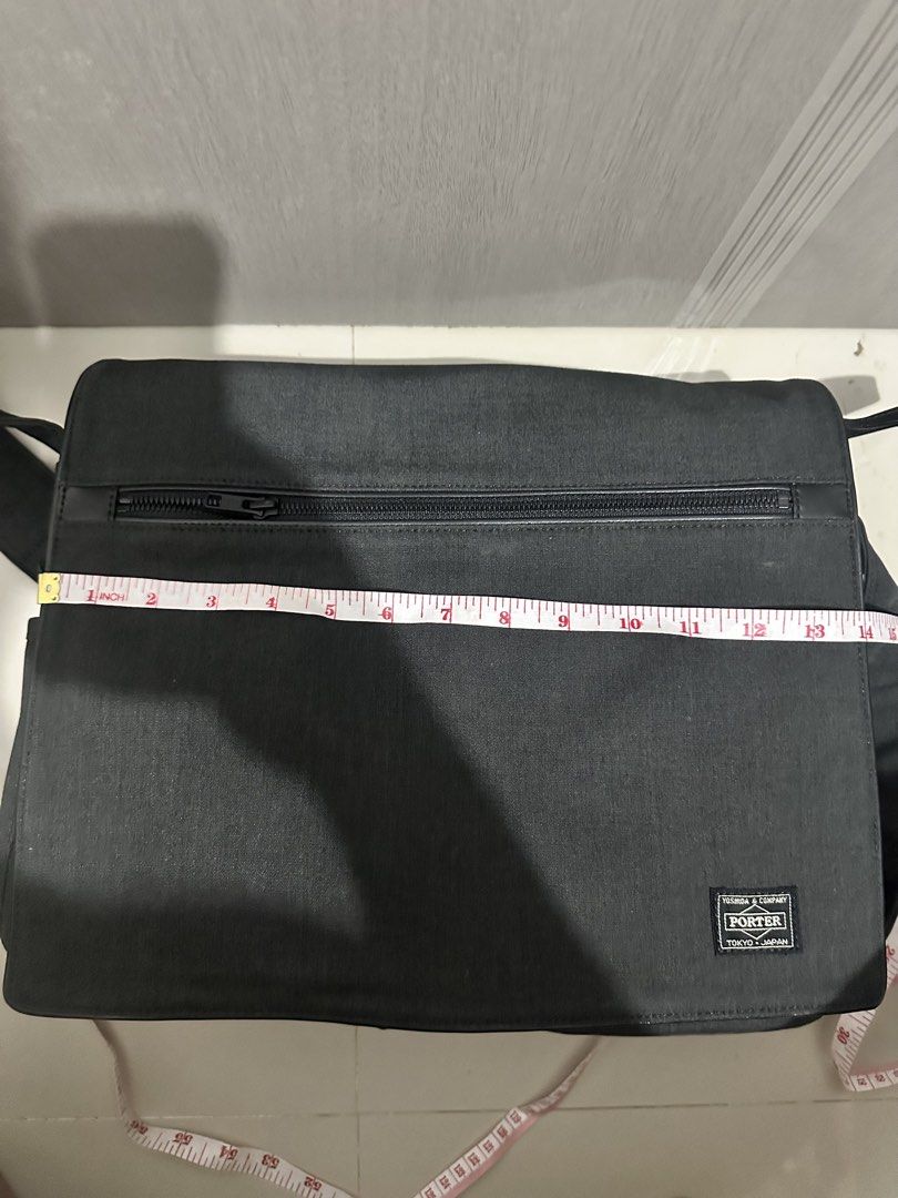 Porter Yoshida & Co Black Messenger Bag (Category: Sling Bags) located in Digos. Submitted by reywearfinds (Listing ID 1468409266, Image 1). Description: - Brand/Origin: Authentic Porter by Yoshida & Co. (Made in Tokyo, Japan) - Color: Classic Black - Dimensions: Approx. 14" W x 11" H - Material: Highly durable canvas-like fabric - Exterior: Front flap design with zippered pocket and iconic woven logo patch - Interior: Secure zipper closure under
