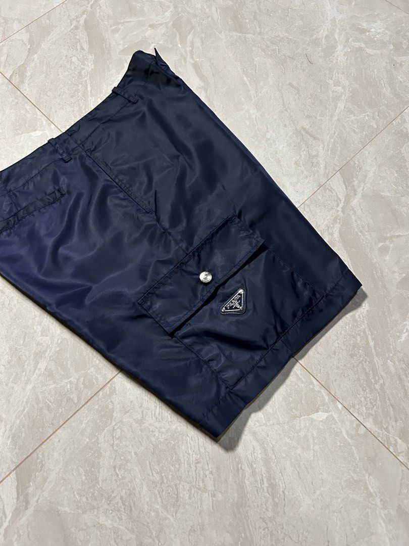 Prada - Re-Nylon Navy Cargo Short (Category: Luxury Apparel) located in Tayabas. Submitted by streetdepartment (Listing ID 1468417566, Image 2). Description: Prada - Re-Nylon Navy Cargo Short Very good condition Flaw/s: loose stitching (kindly check pics for references) Size: 48 on tag Measurements (inches): Waist: 35-36” Length: 19.5” Leg opening: 11.5” Dm to purchase! Note: Manage your expectations as you are dealing with secondhand items. Colo