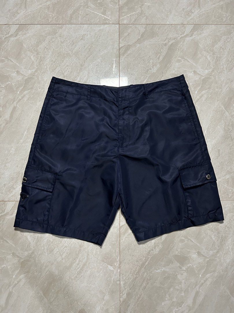 Prada - Re-Nylon Navy Cargo Short (Category: Luxury Apparel) located in Tayabas. Submitted by streetdepartment (Listing ID 1468417566, Image 3). Description: Prada - Re-Nylon Navy Cargo Short Very good condition Flaw/s: loose stitching (kindly check pics for references) Size: 48 on tag Measurements (inches): Waist: 35-36” Length: 19.5” Leg opening: 11.5” Dm to purchase! Note: Manage your expectations as you are dealing with secondhand items. Colo