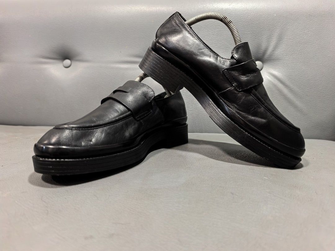 PRADA Black Leather Platform Loafers Size 7 3DG135 (Category: Loafers) located in Cagayan de Oro. Submitted by pootx (Listing ID 1468444906, Image 1). Description: - Brand: PRADA - Color & Material: Black genuine leather upper and lining - Style: Classic penny loafer with trendy chunky platform soles - Size: Interior marked Size 7 (Insole length: approx. 27.5 cm) - Style Code: 3DG135 - Condition: Minor scuffs on outer sole edge from normal wear -