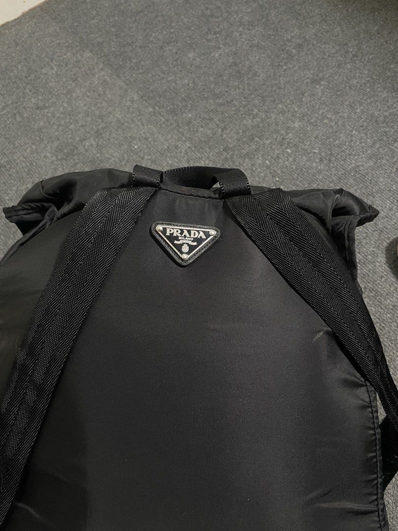Prada Black Nylon Backpack (Category: Backpacks) located in Iligan City. Submitted by lovelysism (Listing ID 1468323747, Image 2). Description: - Brand: Prada - Color: Classic Black - Material: Durable signature nylon -excellent condition No issue With tags .