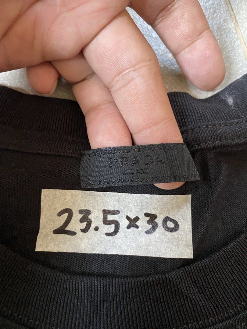 Prada Black on black design Tshirt (Category: Tshirts & Polo Shirts ) located in Digos. Submitted by thriftflexph (Listing ID 1468351305, Image 3). Description: Size&Dimes:23.5/30 Color&Condi:9.8/10 issue:none DM for more information 🫶 Items are all thrifted/Handpicked Can ship nationwide🇵🇭 Add Shipping Fee ✈️🎁.
