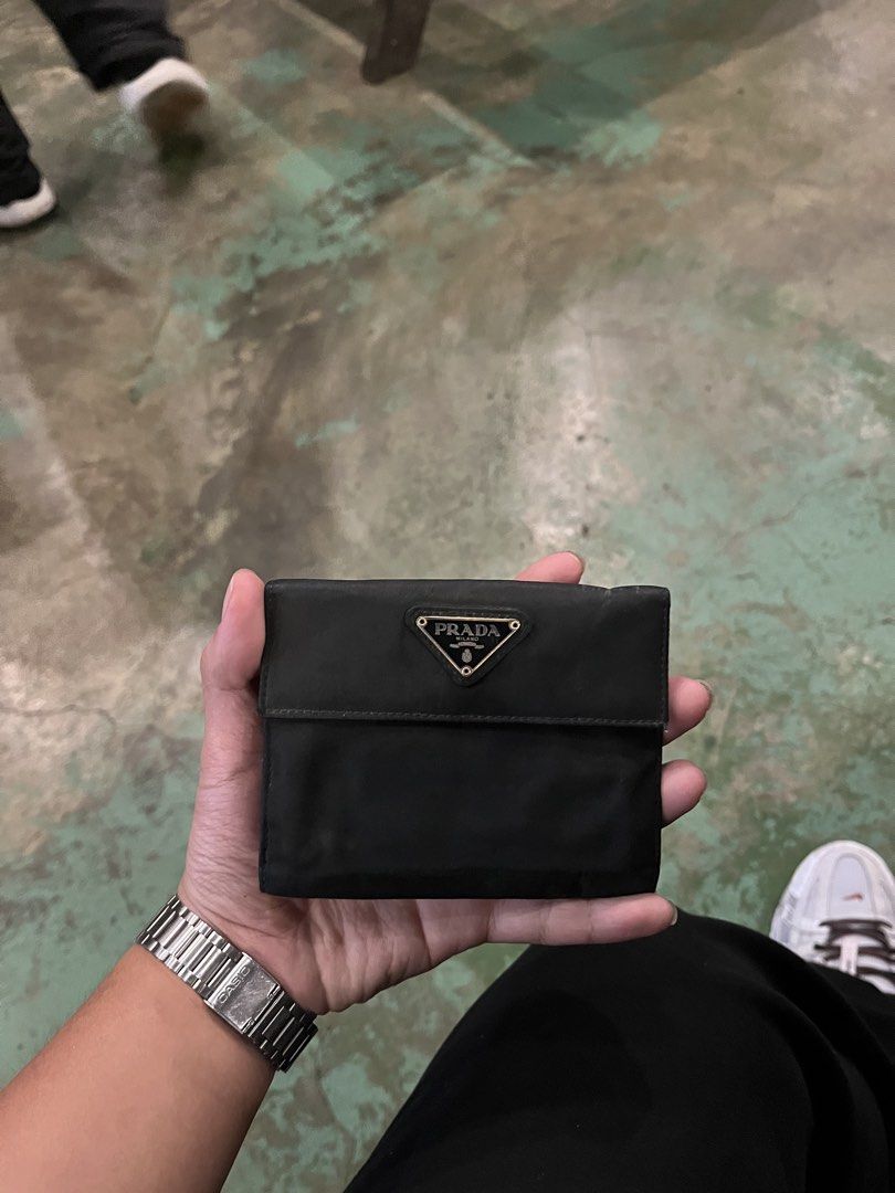 PRADA WALLET (Category: Wallets & Card Holders) located in Abucay. Submitted by rambundang123- (Listing ID 1468444599, Image 1). Description: Authentic Minor Issues Need Cleaning.