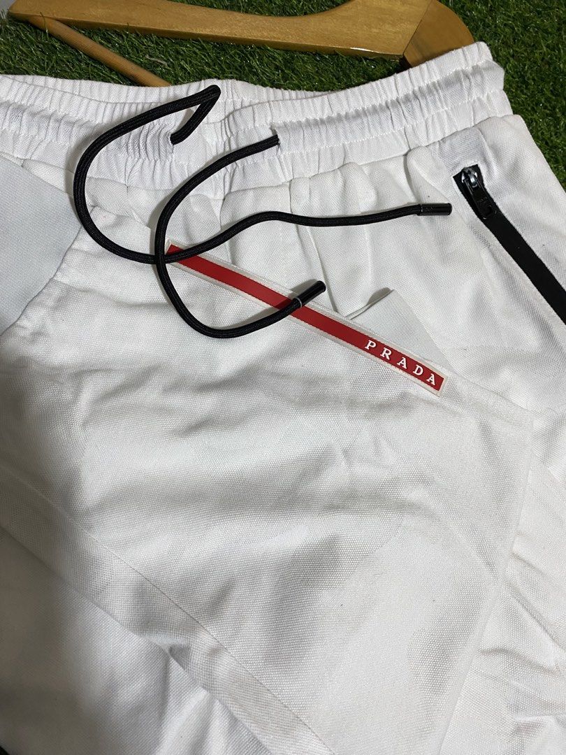 PRADA WHITE JOGGER (Category: Luxury Apparel) located in Polomolok. Submitted by SafeThrift (Listing ID 1468292972, Image 1). Description: PRADA WHITE JOGGER EXCELLENT MINOR ISSUE LAST PIC x LIPSTICK STAIN REMOVABLE NEED WASH COMPLETE TAGS 9.5|10 COLOR RATE 32-34 WAIST 37.5 LENGTH 26 INSEAM MEDIUM - LARGE.