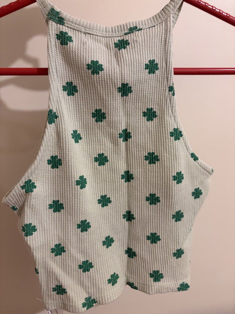 Pull&Bear halter top (Category: Sleeveless) located in Mandaluyong City. Submitted by icheeellee (Listing ID 1468436864, Image 3). Description: - Brand: Pull&Bear - Style: High halter neck crop top - Color/Pattern: Light green with dark green clover print - Fabric: Textured waffle knit - Size: Extra Small (XS).