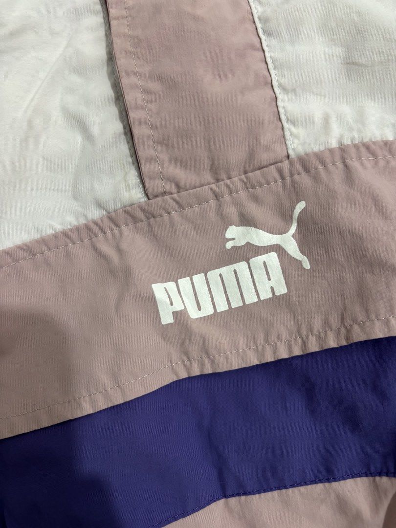 Puma Colorblock Windbreaker Jacket (Category: Coats, Jackets and Outerwear) located in Dasmarinas. Submitted by thriftedgirlie (Listing ID 1468322306, Image 3). Description: - Brand: Puma - Style: Colorblock windbreaker (White, Pink, Purple) - Size: XXL - Features: Half-zip front, hooded neckline, elastic cuffs and hem - Design: Bold vertical PUMA sleeve logos, horizontal chest flap pocket print, and back branding - Condition: Excellent pre-loved