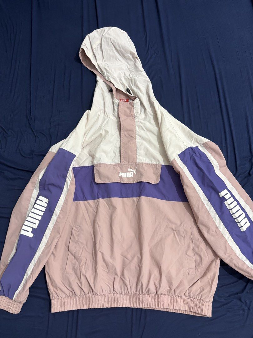Puma Colorblock Windbreaker Jacket (Category: Coats, Jackets and Outerwear) located in Dasmarinas. Submitted by thriftedgirlie (Listing ID 1468322306, Image 1). Description: - Brand: Puma - Style: Colorblock windbreaker (White, Pink, Purple) - Size: XXL - Features: Half-zip front, hooded neckline, elastic cuffs and hem - Design: Bold vertical PUMA sleeve logos, horizontal chest flap pocket print, and back branding - Condition: Excellent pre-loved
