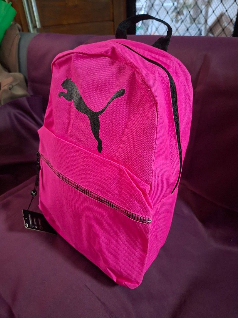 Puma Pink Grandslam Backpack With Tags (Category: Backpacks) located in Cavite. Submitted by vastowl_7d1ce5 (Listing ID 1468330285, Image 1). Description: - Brand new with original tags attached - Eye-catching bright pink design with a bold black Puma logo - Comfortable adjustable padded straps and sturdy top handle - Convenient side mesh pocket for water bottles - Secure zipper closure for the main compartment.
