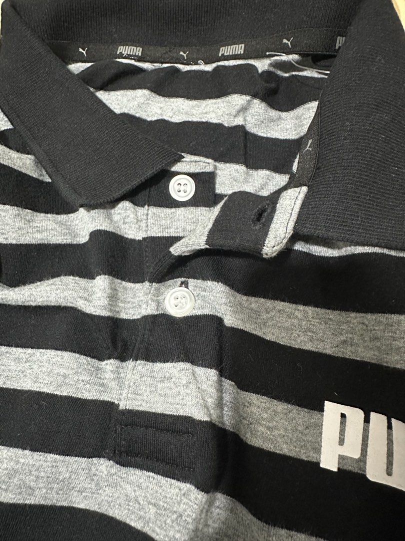Puma Polo Shirt (Category: Tshirts & Polo Shirts ) located in Subic. Submitted by declutterbyshit (Listing ID 1468331146, Image 2). Description: Puma polo shirt Used once or Washed once lang ata pero new 29x20 350 - Design: Black and grey stripes with white Puma logo on chest - Details: Classic collar with two white buttons, ribbed black collar and cuffs - Fit/Material: Comfortable casual wear - Ideal for: Everyday outings or sports activities.