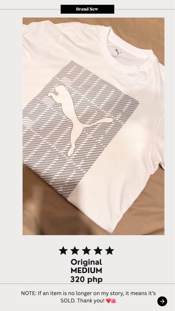 Puma White Graphic Tee Medium (Category: Tshirts & Polo Shirts ) located in Bulacan. Submitted by pots.collection (Listing ID 1468437943, Image 1). Description: - Brand: Puma - Color: White - Size: Medium - Design: Large graphic print with iconic cat logo and stripes on the front - Style: Crew neck, short sleeves - Condition: Clean, everyday casual wear - Authentic and original.