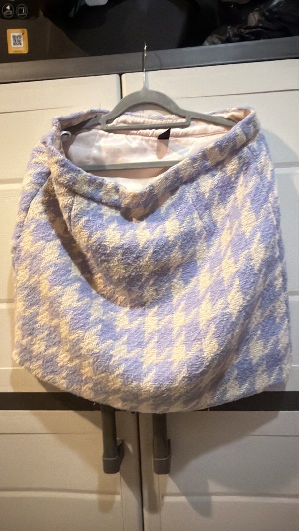 Purple Houndstooth Tweed Mini Skirt (Category: Skirts) located in Manila. Submitted by adoptmypreloveditems (Listing ID 1468477627, Image 1). Description: - Purple and white houndstooth tweed mini skirt - Thick, textured fabric with a smooth inner lining - Mid-waist fit with a convenient back zipper closure - Classic pattern that easily pairs with plain tops - Versatile style great for casual outings or office wear.