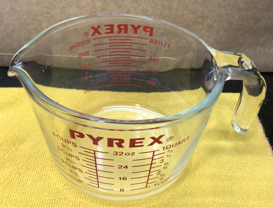 Pyrex 4-Cup Glass Measuring Cup 32 oz (Category: Bakeware) located in Quezon City. Submitted by may.reyes (Listing ID 1468297758, Image 2). Description: - Genuine Pyrex 4-cup (32 oz) capacity glass measuring cup - Clear glass body featuring easy-pour spout and sturdy handle - Red printed markings for cups, ounces, quarts, and liters - Standard kitchen essential for accurate baking and cooking - Clean interior and exterior with markings fully inta