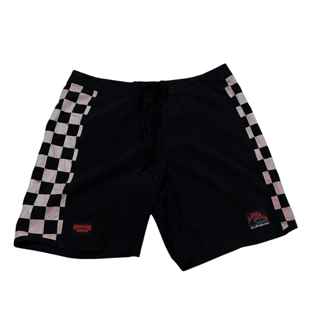 Quiksilver x Stranger Things Board Shorts (Category: Swim Trunks & Board Shorts) located in Cagayan de Oro. Submitted by lootfindzzzz (Listing ID 1468354989, Image 1). Description: - Official Quiksilver x Stranger Things collaboration board shorts - Classic black colorway with stylish checkered side panels - Secure drawstring waist closure for a custom fit - Features Stranger Things logo patch on left leg and Quiksilver patch on right leg - Light