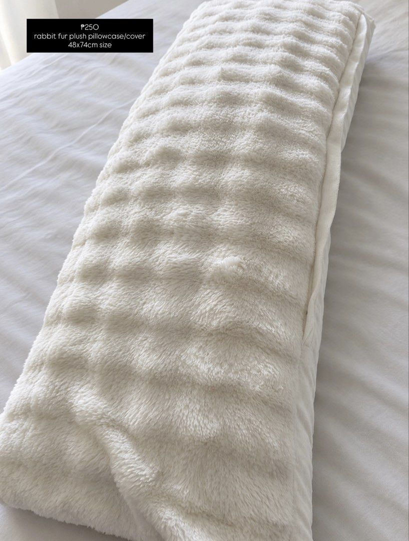 Rabbit fur plush pillowcase cover 48x74cm (Category: Bedding & Towels) located in Mandaluyong City. Submitted by ireneangelinee (Listing ID 1468379571, Image 1). Description: - Size: 48x74cm - Material: Ultra-soft white rabbit fur plush for a cozy feel - Design: Stylish textured grid pattern to elevate your bedroom decor - Easy Care: Simple to slip on and off for a quick room makeover - Condition: Brand new -rfs: bought the wrong size.