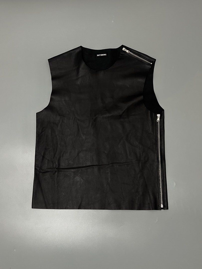 Raf Simons - S/S’12 Runway - Leather - Side & Shoulder zip (Category: Vests) located in Cavite. Submitted by asianluxe (Listing ID 1468432282, Image 1). Description: Raf simons - ss12 runway - Black Leather- Flat Measurements! 20 inches armpit to armpit 25.5 inches length 16.5 inches shoulder to shoulder 14.5 inches chest 20 inches hem excellent condition Very presentable 10/10 condition Authentic Archive raf simons If u interested my item, Drop 